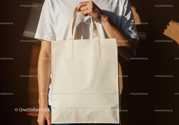 Person Holding Plain Reusable Cotton Tote Bag JPG Mockup Image