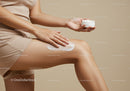 Woman Applying Moisturizing Lotion to Her Thigh for Soft Skin