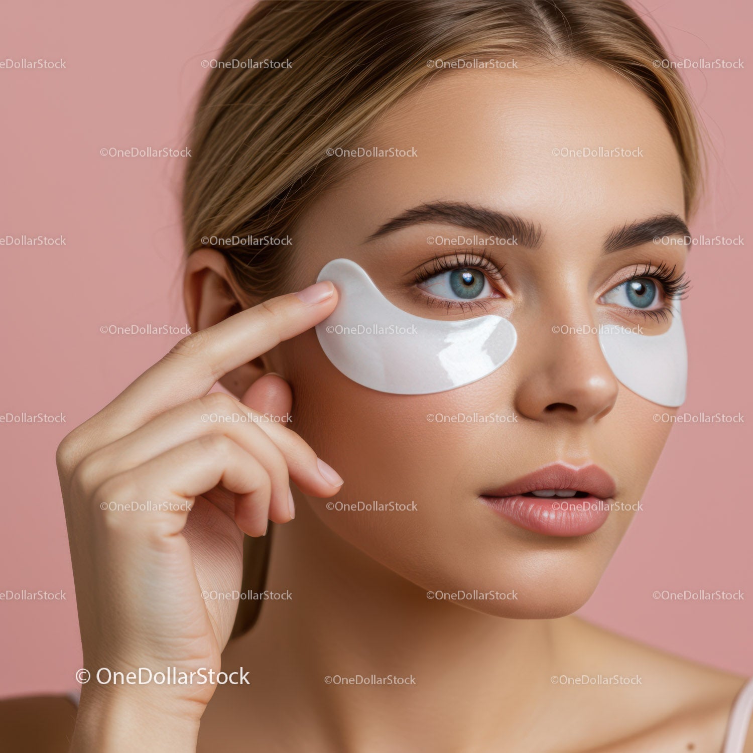 Young Woman with Under Eye Patches Applying Skincare Treatment