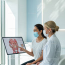Healthcare Professionals Discussing Anatomy Using Digital Medical Chart