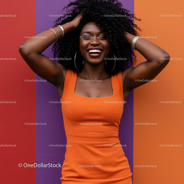 Joyful Black Woman in Orange Dress Against Colorful Wall