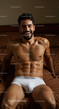 Smiling man relaxing comfortably in white briefs