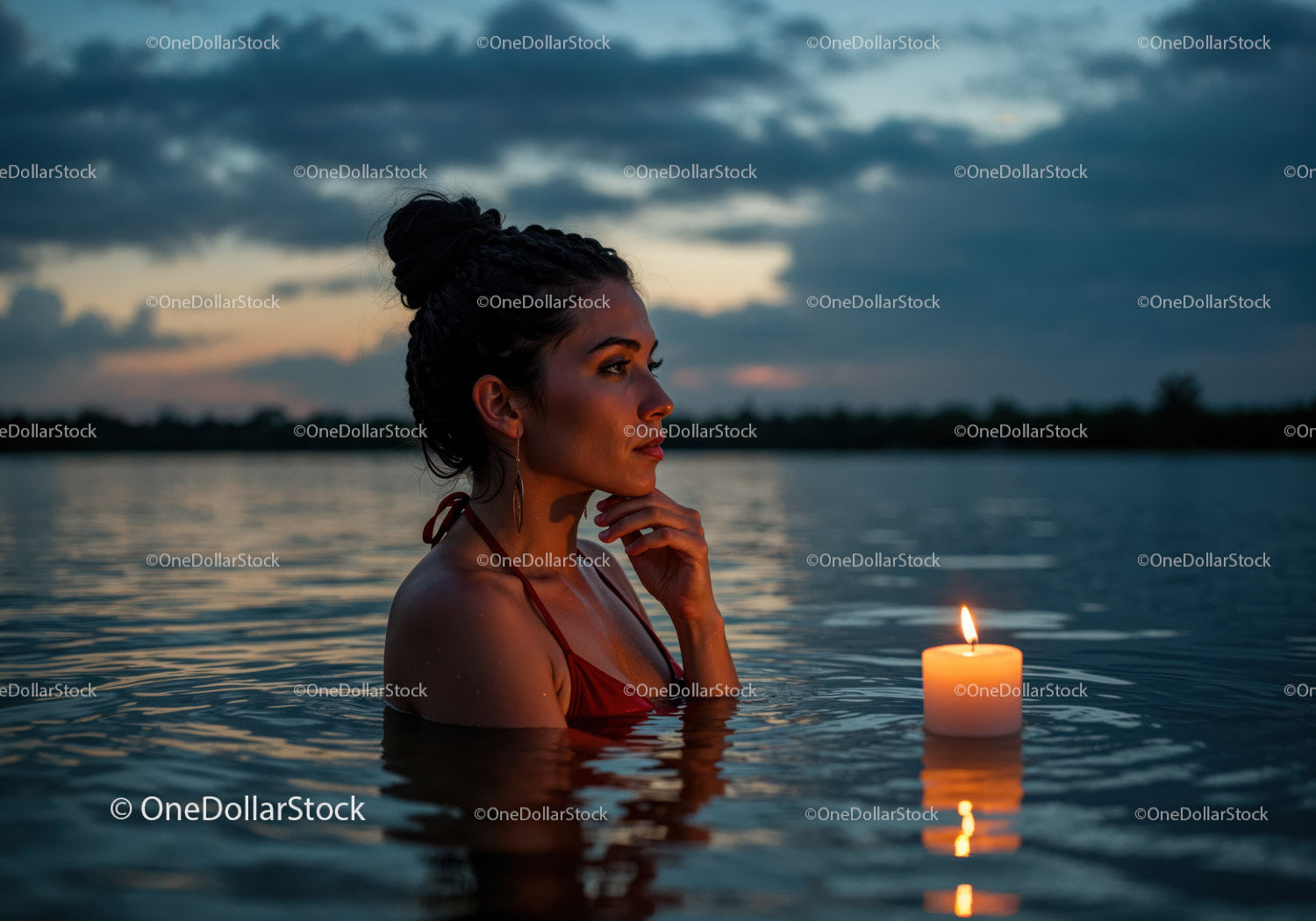 Woman in Black Bikini with Candles Floating in Lake at Sunset