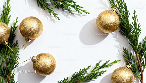 Golden Christmas Ornaments and Green Pine Branches Frame