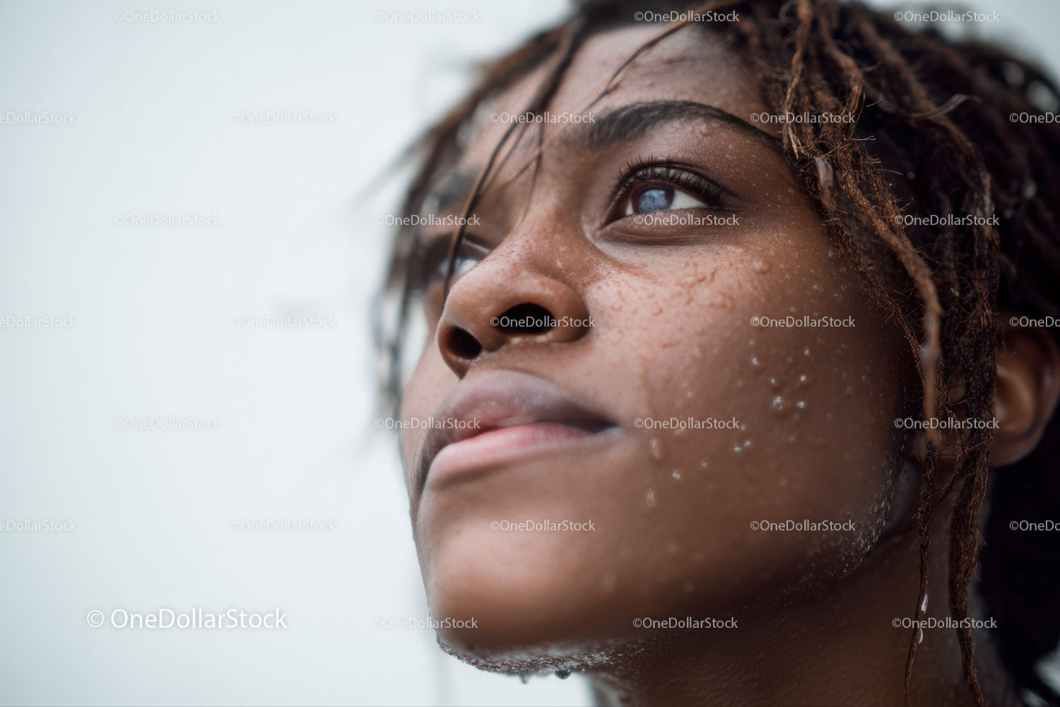 Close-up of Black Woman with Water Droplets and Natural Glow