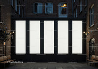 Empty vertical billboard panels in cozy urban courtyard