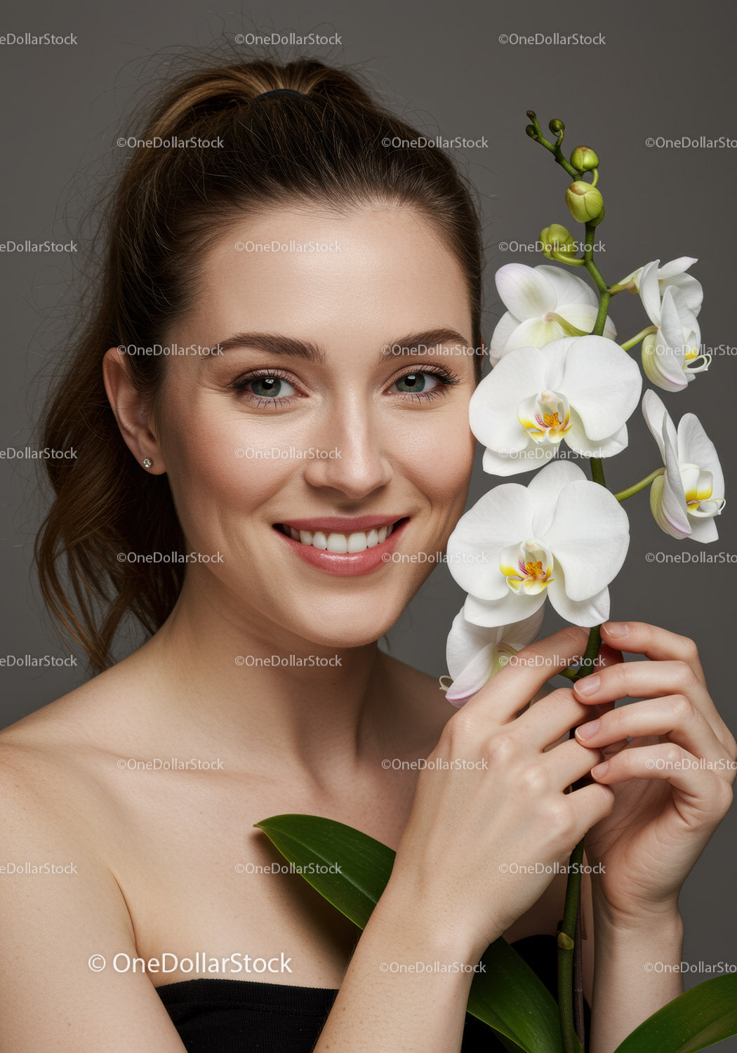 Elegant Woman Holding White Orchid Flower for Beauty and Wellness