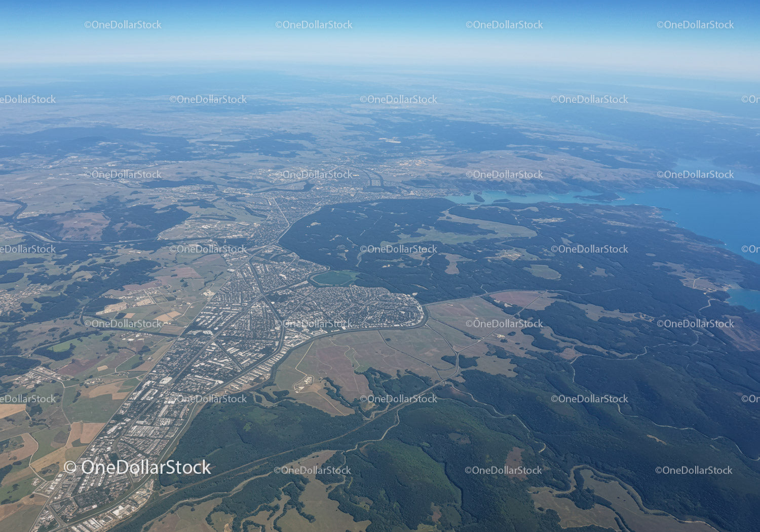 Aerial View of Urban and Natural Landscape with Lakes and Forests