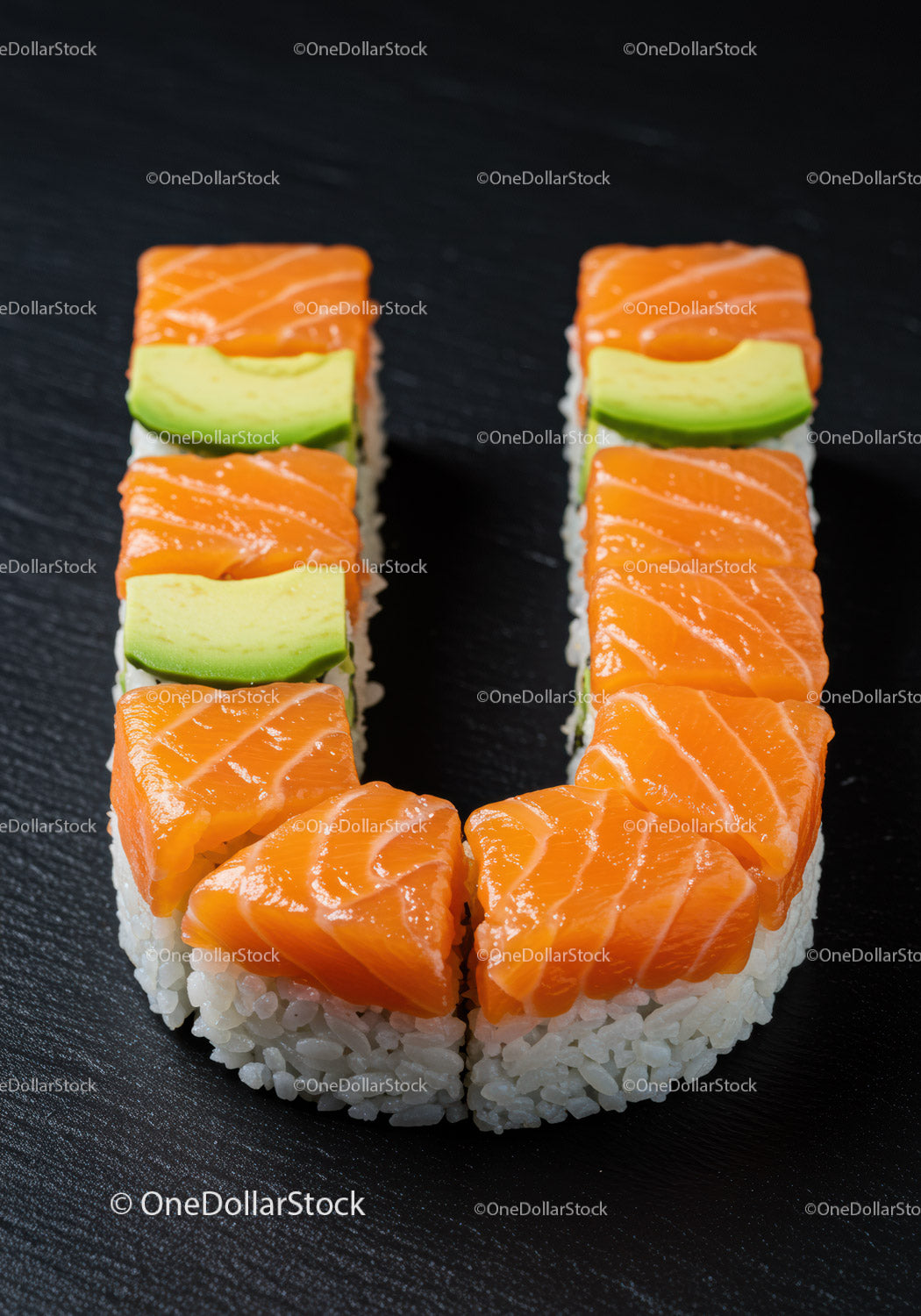 Fresh salmon and avocado sushi arranged in U shape