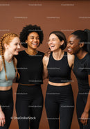 Diverse group of women smiling in activewear