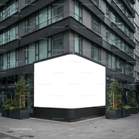 Modern building corner with large blank advertising panel