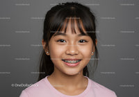 Smiling Girl with Dark Hair and Braces in Pink T-Shirt