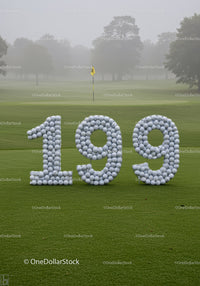 Golf milestone celebration with balls shaped 199 on green