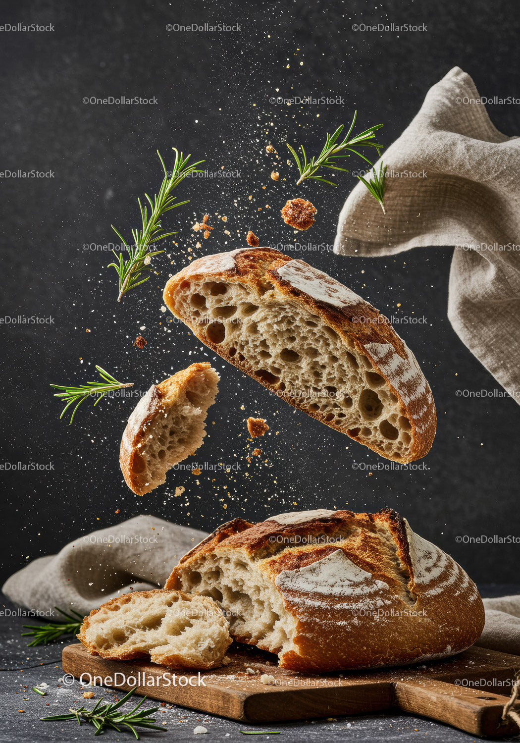 Rustic sourdough bread flying with fresh rosemary herbs