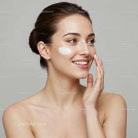 Elegant Young Woman Applying Face Cream with Skincare Routine