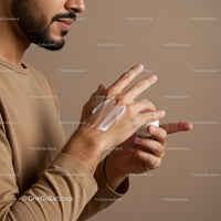 Man Applying Hand Lotion in Personal Care Routine with Moistuizing Action