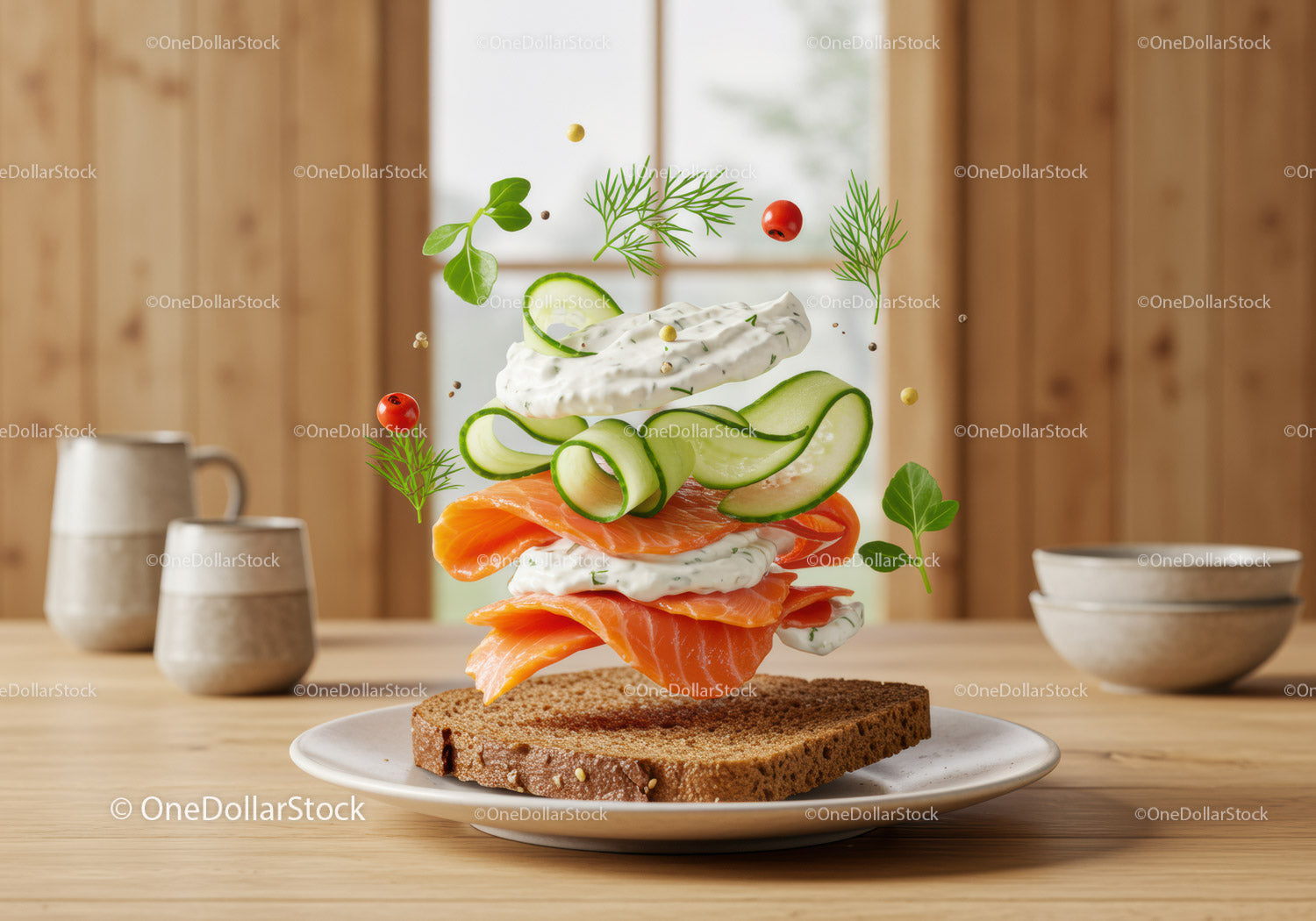 Fresh salmon open sandwich with herbs and cucumber slices