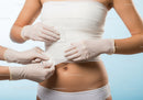 Medical Examination of Female Abdomen with Healthcare Professional