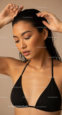 Elegant Woman with Black Wet Hair and Black Bikini Top