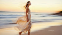 Graceful Woman Walking Along a Serene Beach at Dusk