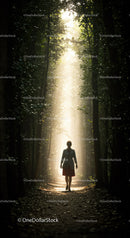 Woman walking through sunlit forest path