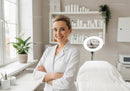 Friendly Female Doctor Standing in Modern Medical Clinic