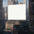 Empty urban billboard towering over city rooftops