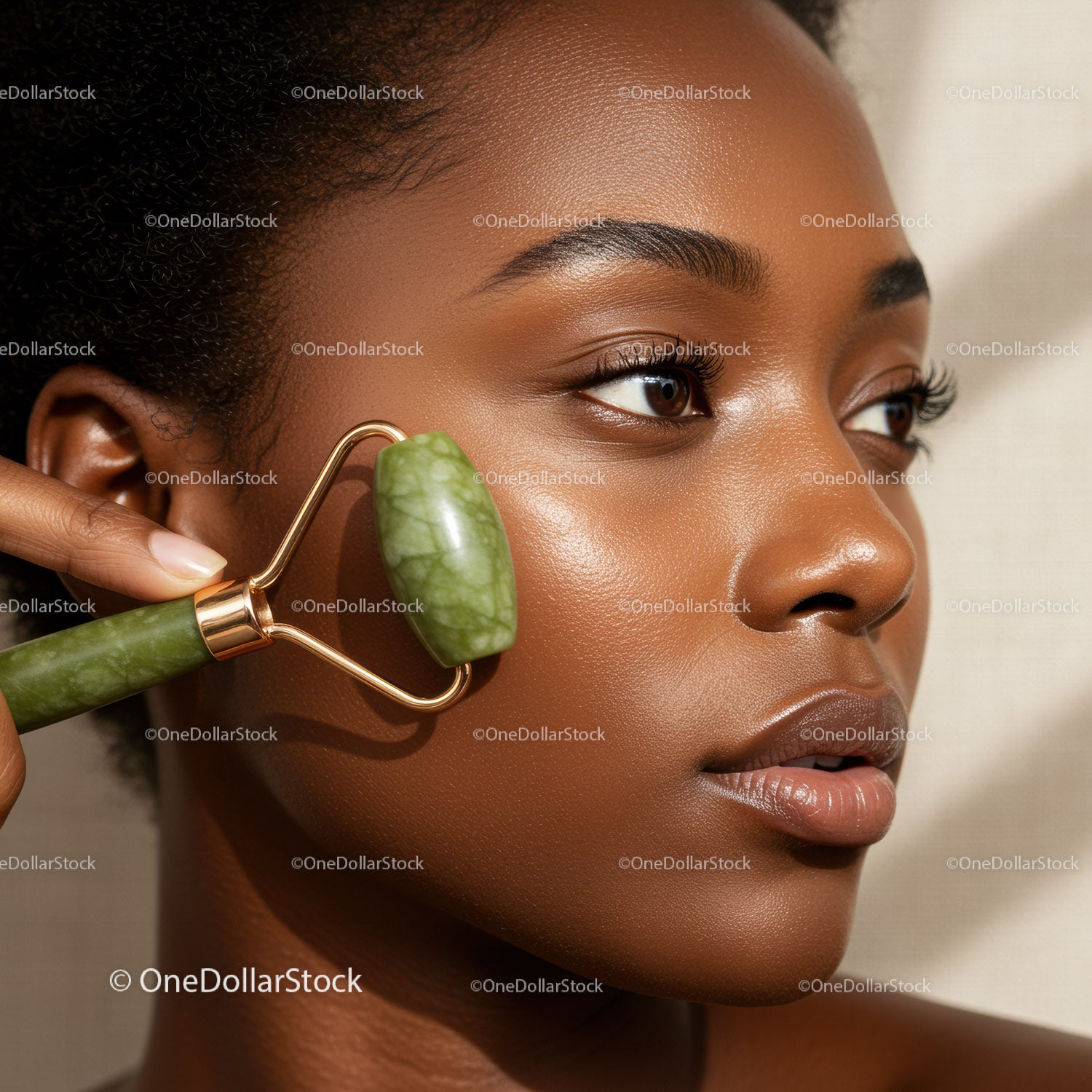 Close-Up of a Woman Using a Jade Roller on Her Face for Skin Rejuvenation