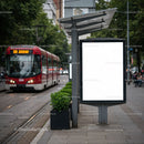 Empty urban billboard at modern tram stop in city