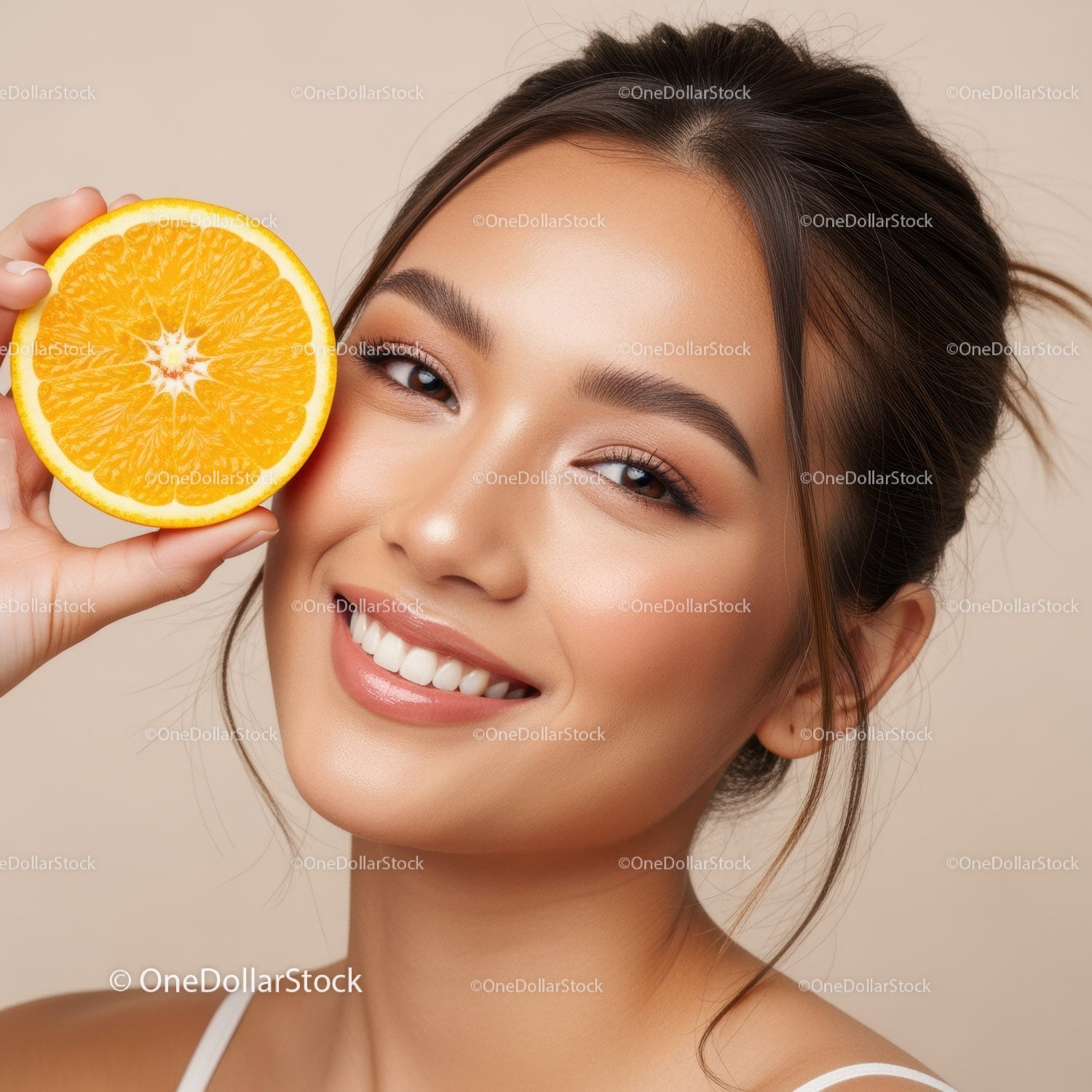 Bright Smiling Woman with Orange Slice Highlighting Fresh Natural Beauty
