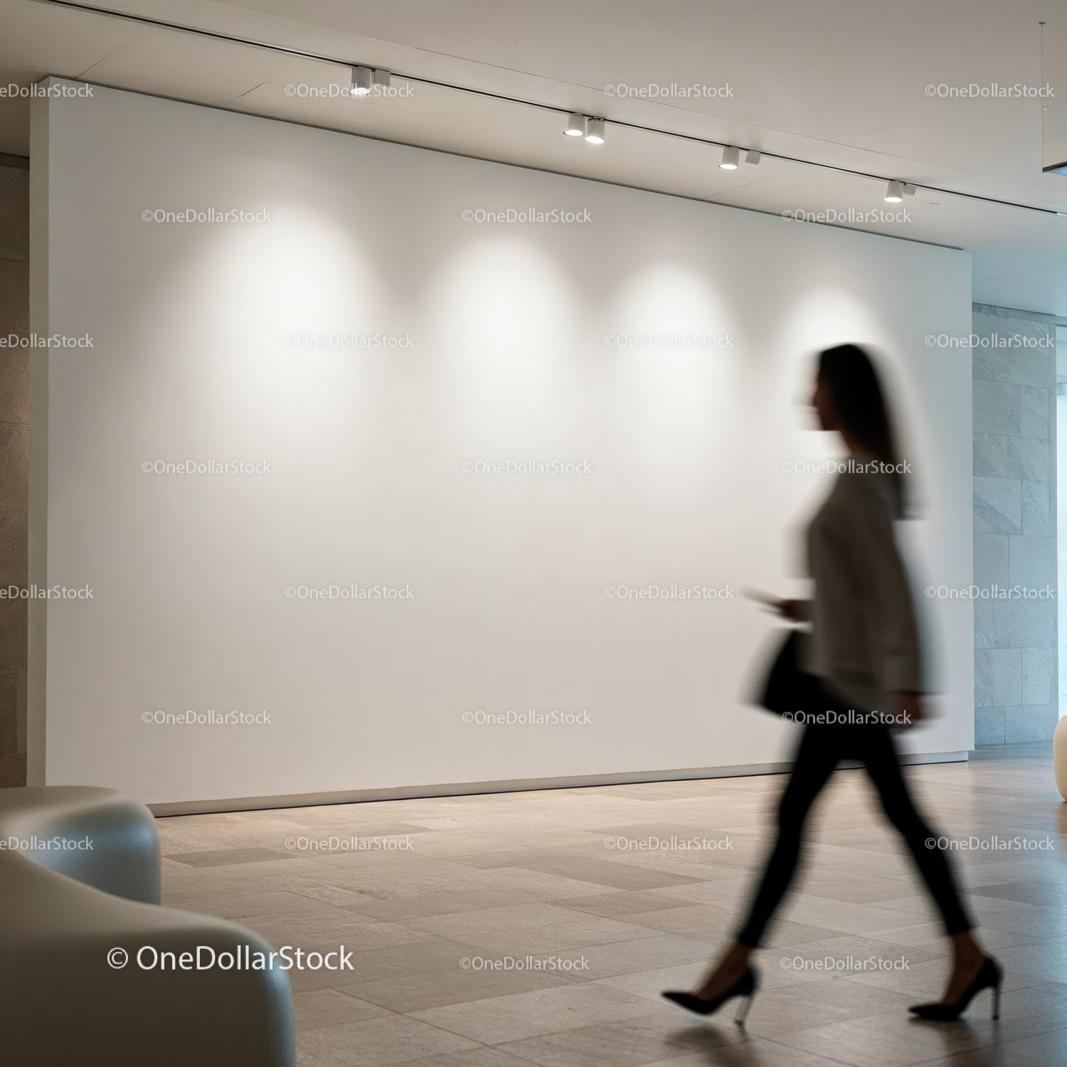 Blurred Woman Walking Past Empty Gallery Wall