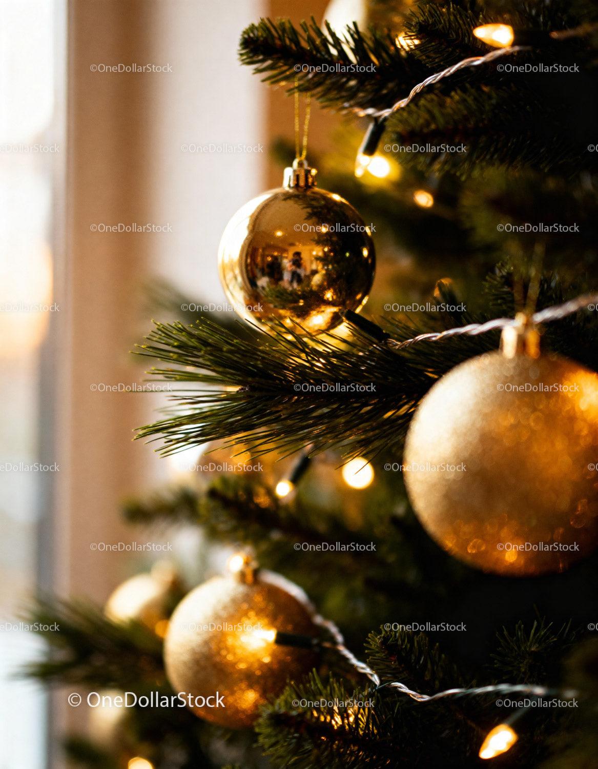 Festive Gold Ornaments on a Christmas Tree Close Up