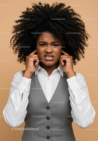Frustrated Woman Covering Ears with Annoyed Expression