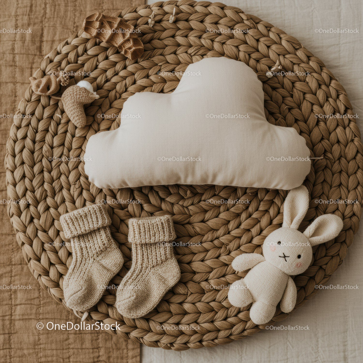 Cozy baby essentials arranged on woven placemat