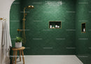 Modern shower with green scallop tiles and gold fixtures
