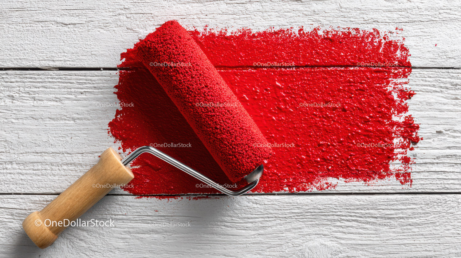 Red Paint and Painting Roller On White Wooden Surface