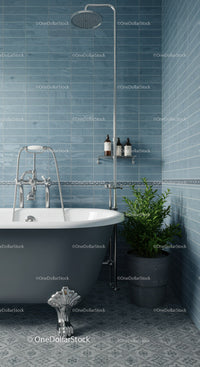 Modern clawfoot bathtub with shower in blue tiled bathroom
