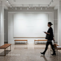 Woman walking through modern minimalist gallery space
