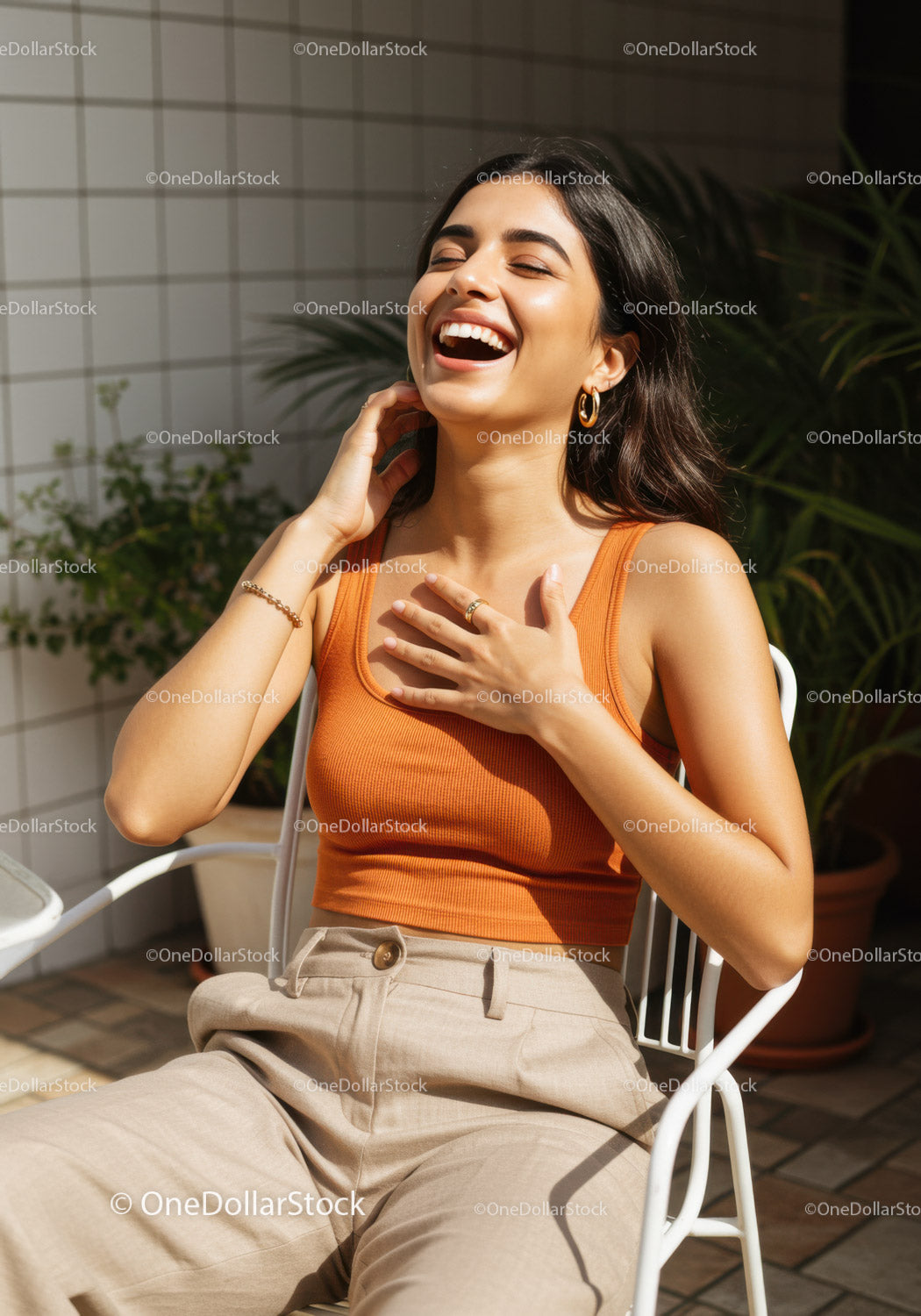 Joyful Woman in Orange Tank Top with Gold Jewelry Outdoors