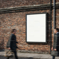 Blank billboard on urban brick wall with pedestrians passing