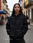 Fashionable Woman Wearing Black Hoodie in Urban City Street