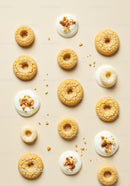 Round corn snacks with yogurt and crumb toppings
