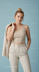Fashionable Woman in Beige Crop Top and High-Waisted Trousers