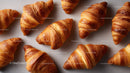 Fresh Croissants with Flaky Layers in Bakery Setting
