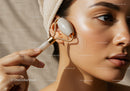 Young Woman Using Jade Roller for Skincare and Face Massage