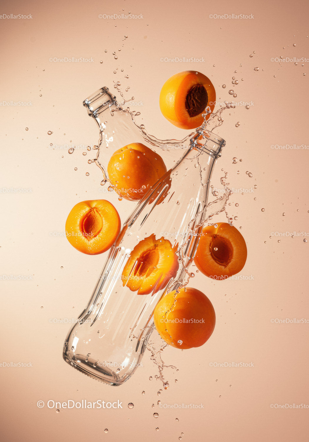 Fresh apricots splashing around empty glass bottle