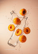 Fresh apricots splashing around empty glass bottle
