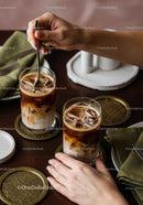 Refreshing Iced Coffee Drinks with Milk on Warm Wooden Table