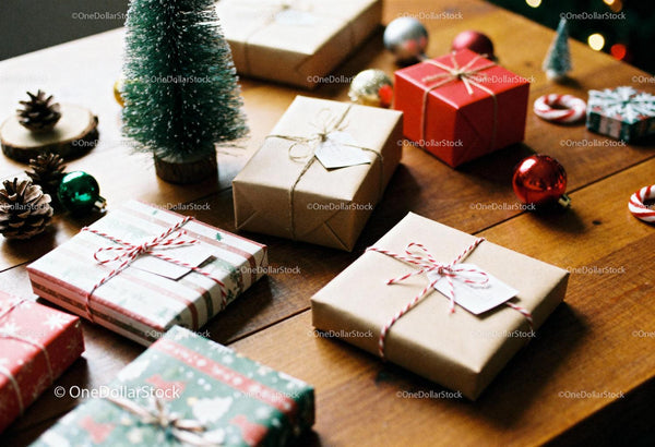 Festive Christmas gifts and decorations on wooden table