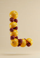 Letter L made of fresh oranges and ripe raspberries